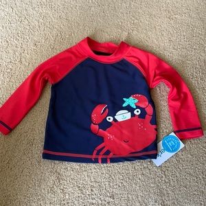Carter’s baby swim trunks and rash guard